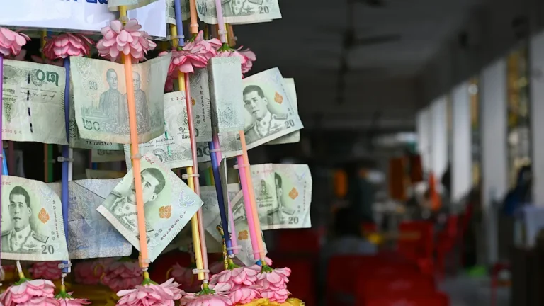 Thai money at a temple in Bangkok, Thailand